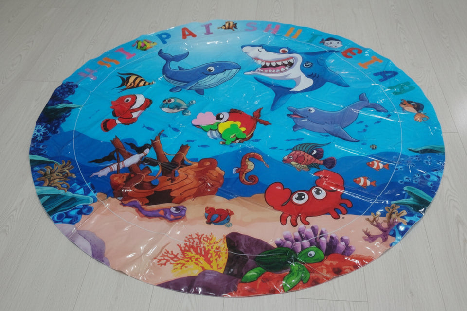 Round plastic mat with underwater animal design on a white surface