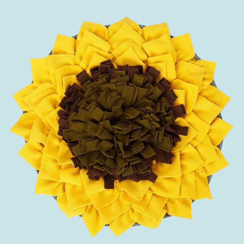 Sunflower-shaped pet mat with yellow petals and brown center on a white background