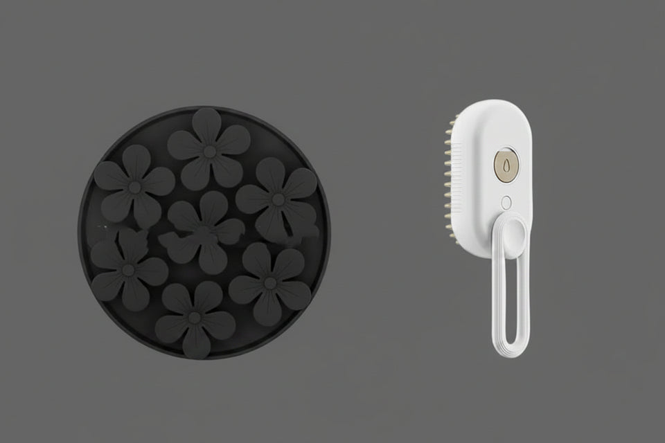 Black silicone mold with flower shapes and a white handheld cleaning brush on a white background