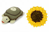 Tortoise-shaped plush toy on the left and sunflower-shaped plush toy on the right.