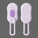 Purple and white grooming brush on a white background
